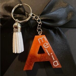 Orange, brawn Initial Keyring with Tassel